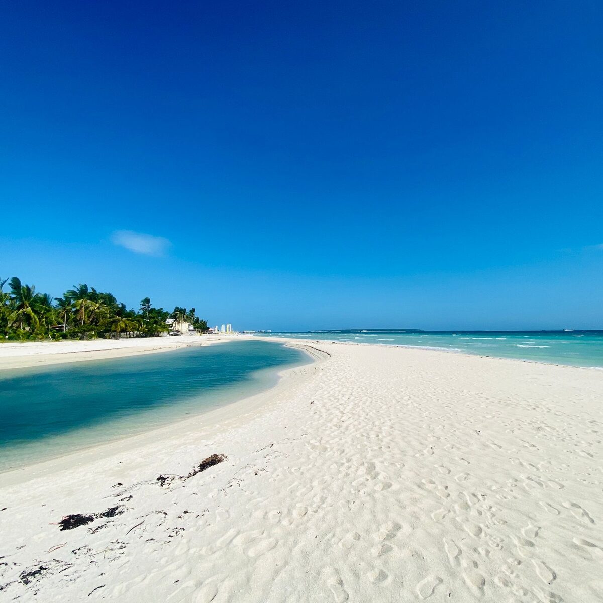 White-sand bay at Haad Yao meeting clear turquoise water